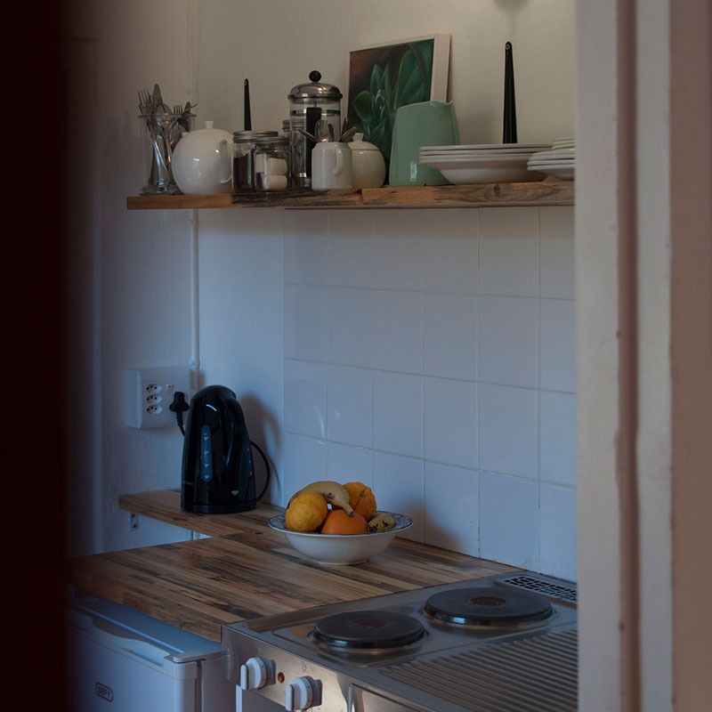 the shared kitchenette inside Birch Cottage at Wildekrans Cottage House